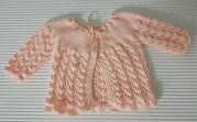 Unknown brand estimated 3-6 months peach knitted jersey
