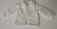Unknown brand estimated 3-6 months cream knitted jersey